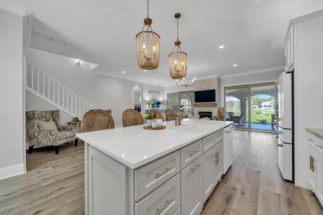 a bedroom with a bed and a flat tv screen on dresser