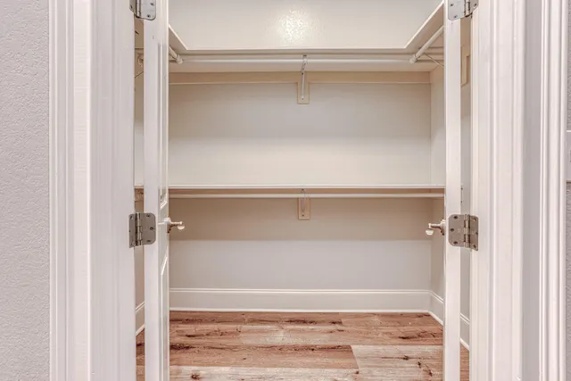 a view of a workspace with furniture and a bookshelf