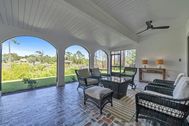 a room view with a bed and a view of bedroom