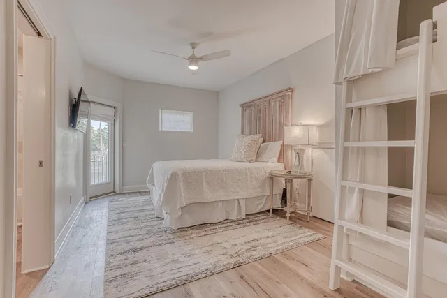 a view of a lake with boats and trees in the background