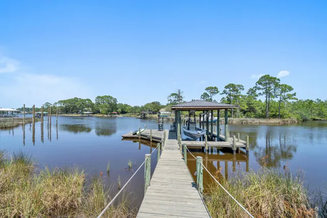 a view of a lake with outdoor seating