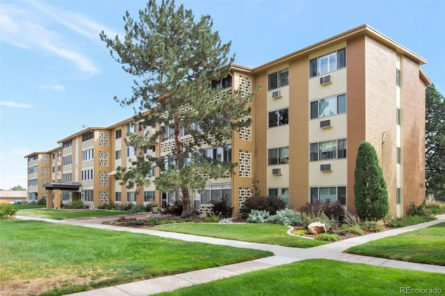 front view of a building with a yard