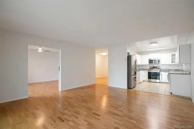 a view of a kitchen with wooden floor
