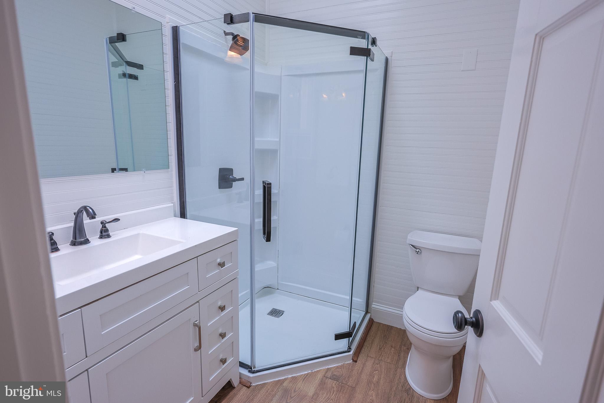 98 Swindler Hollow Road Sperryville, VA 22740 - Photo 10 of 25 a bathroom with a sink a toilet and shower