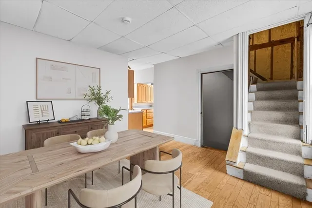 a view of a dining room with furniture window and wooden floor