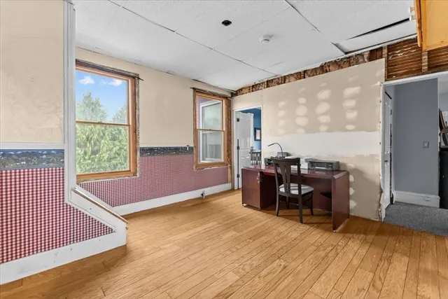 a view of workspace with furniture and window