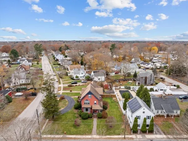 an aerial view of residential houses with city view
