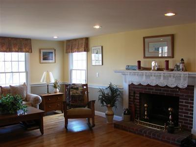 Undisclosed Address Dennis, MA 02638 - Photo 14 of 29 a living room with furniture and a fireplace