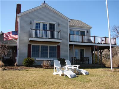 Undisclosed Address Dennis, MA 02638 - Photo 24 of 29 a backyard of a house with yard and seating space