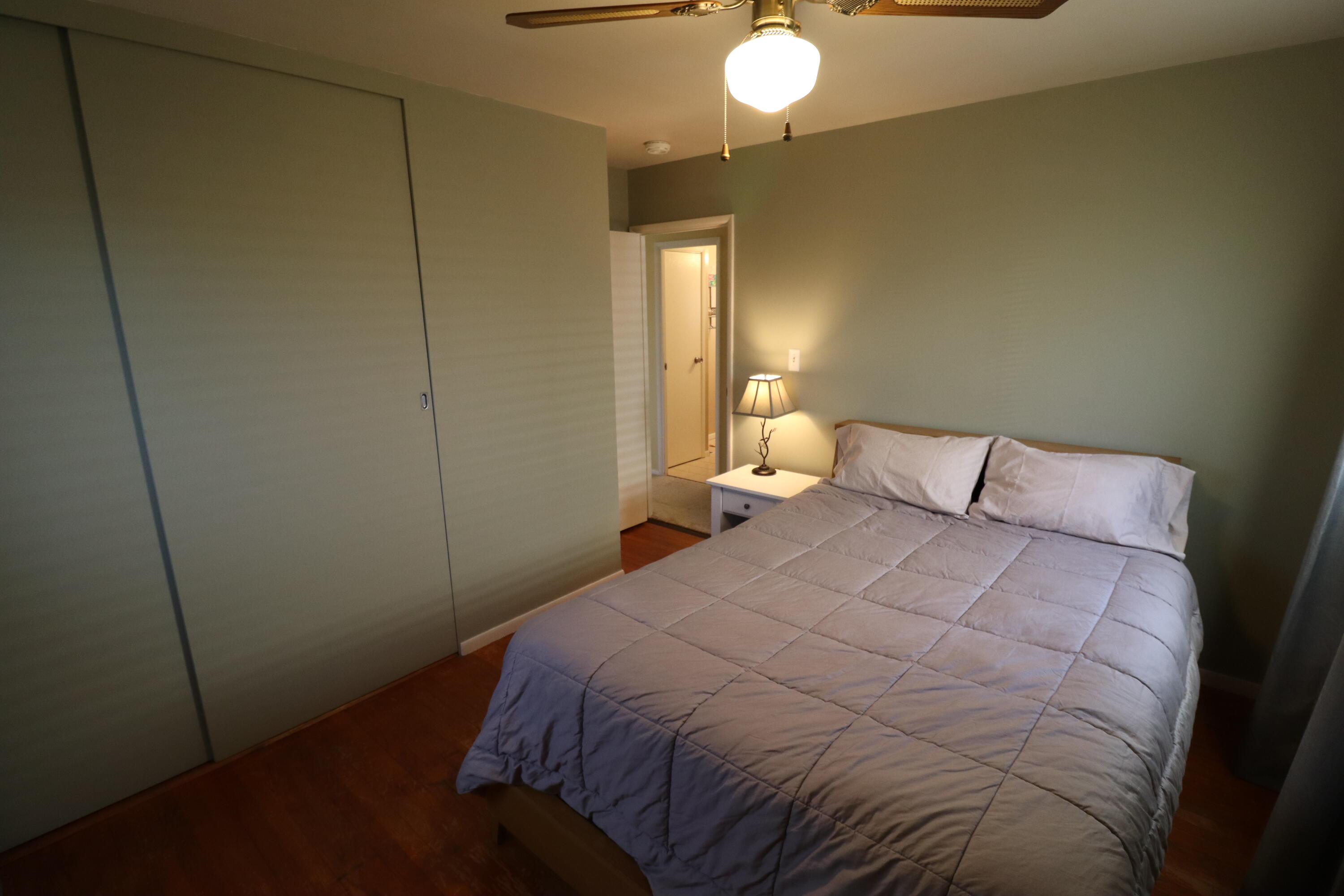 3867 South Liverpool Road Hobart, IN 46342 - Photo 12 of 27 a bedroom with a bed and lamp