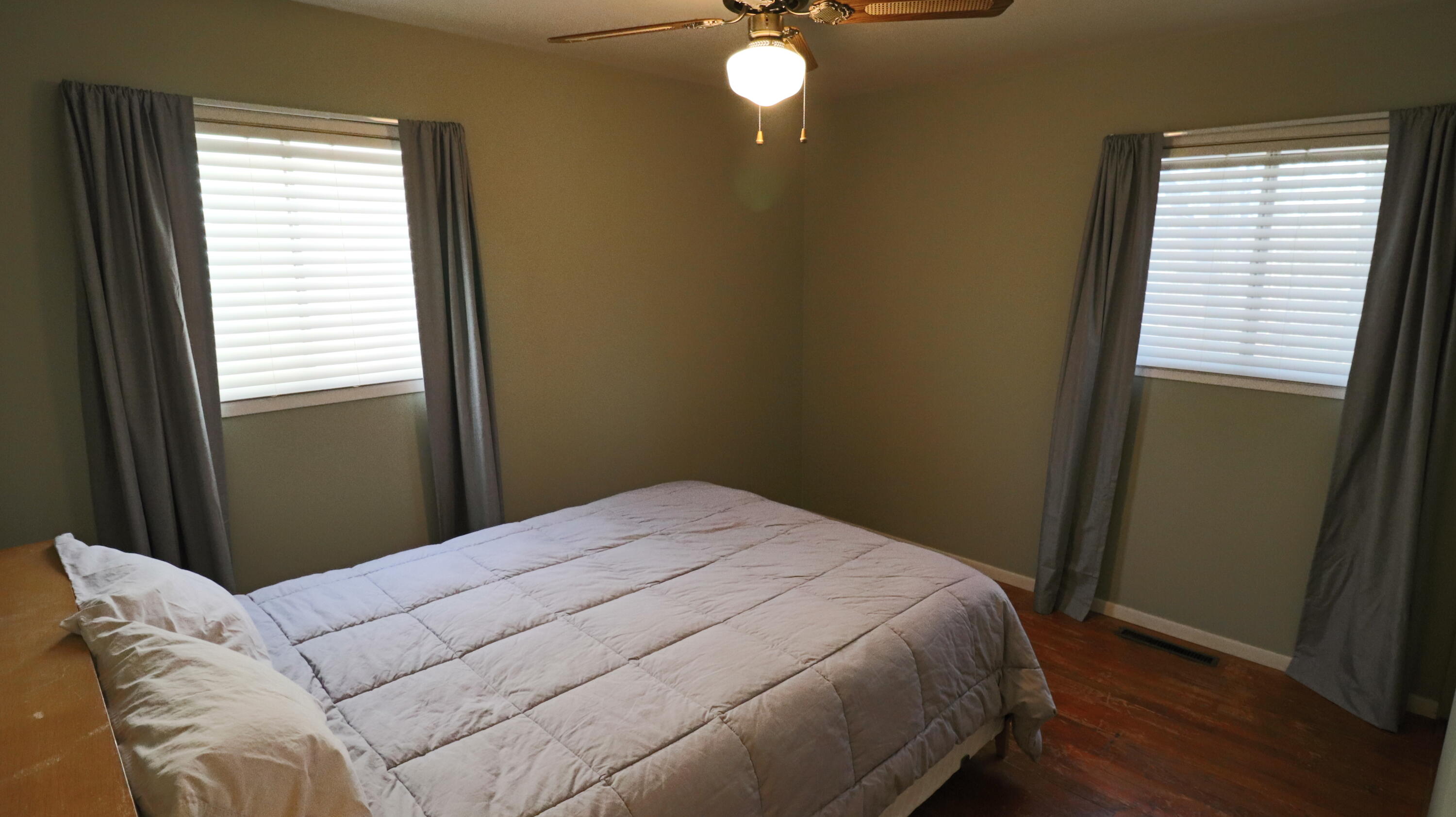 3867 South Liverpool Road Hobart, IN 46342 - Photo 17 of 27 a bed sitting in a bedroom next to a window