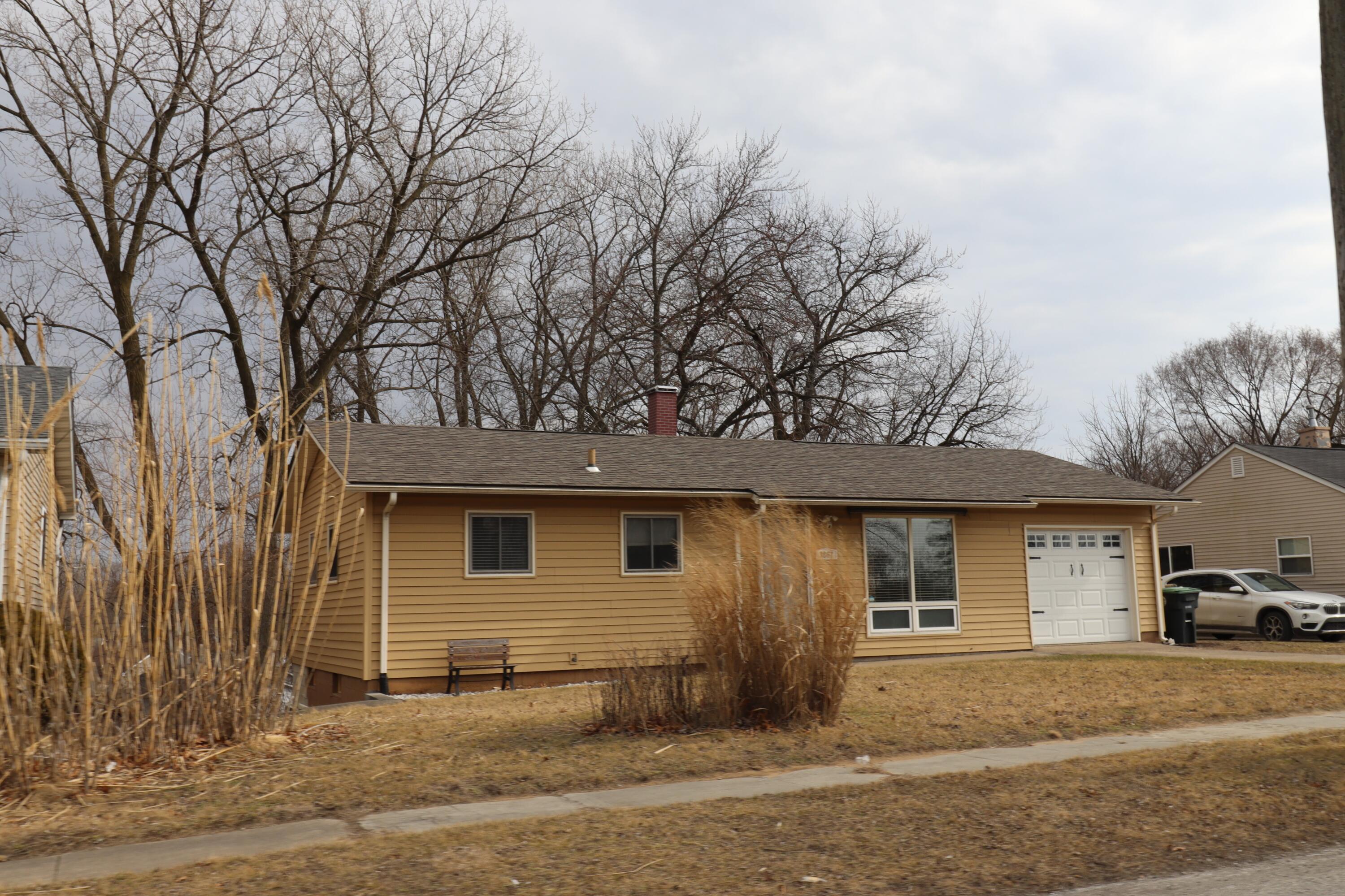 3867 South Liverpool Road Hobart, IN 46342 - Photo 2 of 27 a front view of a house with a yard and garage
