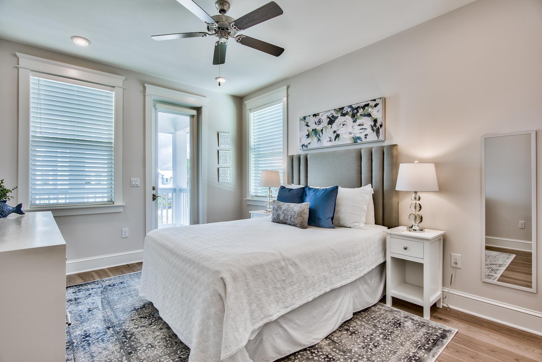 75 Siasconset Ln Inlet Beach Inlet Beach, FL 32461 - Photo 23 of 64 a bedroom with a large bed and a chandelier