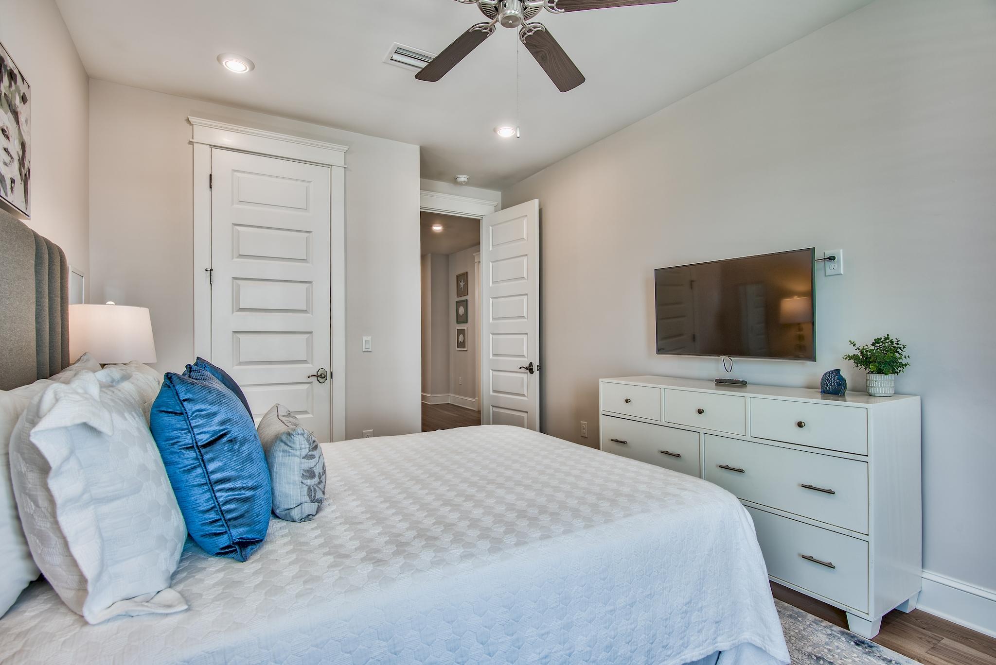 75 Siasconset Ln Inlet Beach Inlet Beach, FL 32461 - Photo 24 of 64 a bedroom with a bed and a flat screen tv in it