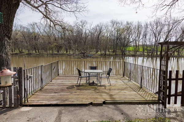 a view of a lake with a bench next to a lake