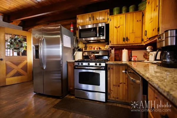 a bedroom with a bed and a fireplace