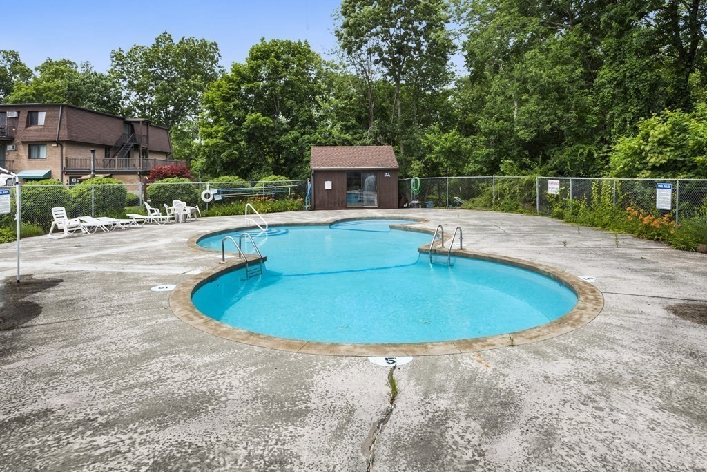 800 County Street, Unit 20 Taunton, MA 02780 - Photo 16 of 19 a view of a swimming pool with a yard