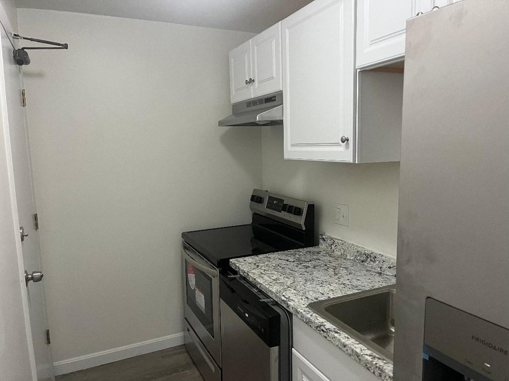 800 County Street, Unit 20 Taunton, MA 02780 - Photo 5 of 19 a kitchen with a stove and a sink