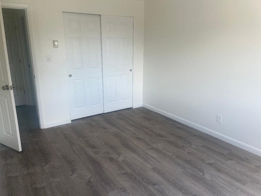 800 County Street, Unit 20 Taunton, MA 02780 - Photo 8 of 19 an empty room with wooden floor