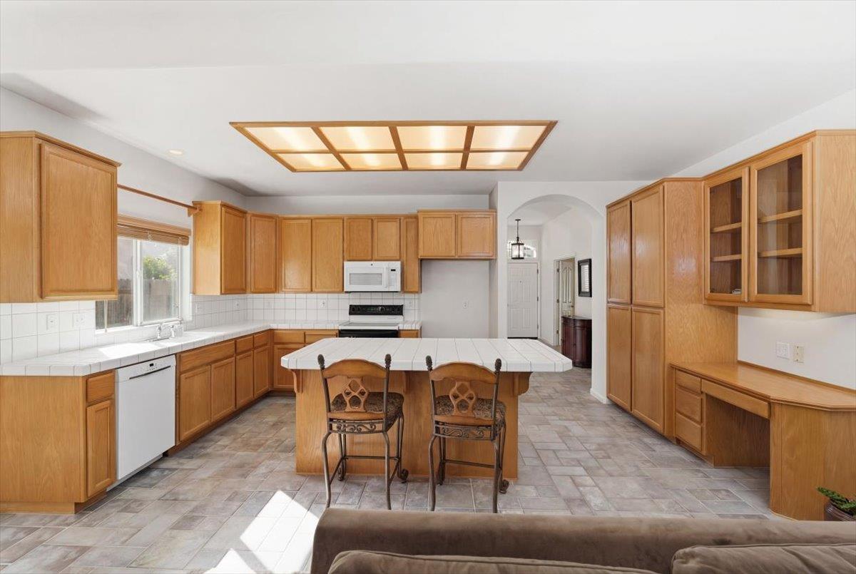 1903 Alex Way Turlock, CA 95382 - Photo 12 of 40 a large kitchen with a table and chairs in it