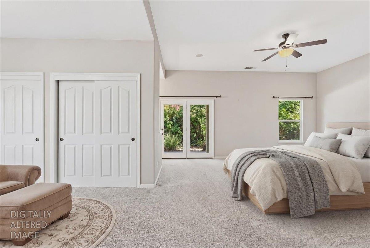 1903 Alex Way Turlock, CA 95382 - Photo 18 of 40 a spacious bedroom with a bed and furniture