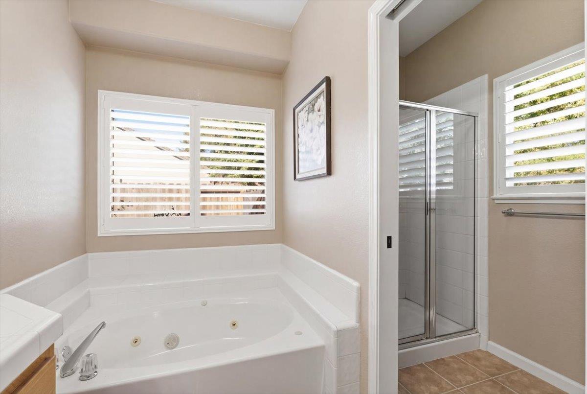 1903 Alex Way Turlock, CA 95382 - Photo 22 of 40 a white bath tub sitting next to a window
