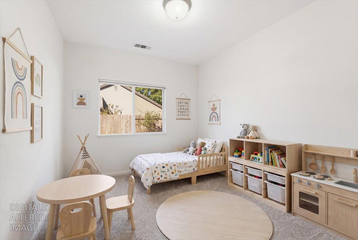 1903 Alex Way Turlock, CA 95382 - Photo 25 of 40 a bedroom with furniture and a wooden floor