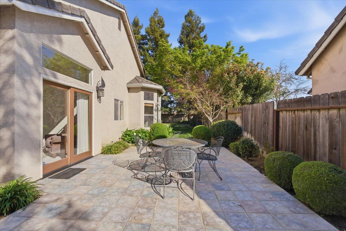 1903 Alex Way Turlock, CA 95382 - Photo 34 of 40 a view of a chair and table in backyard of the house