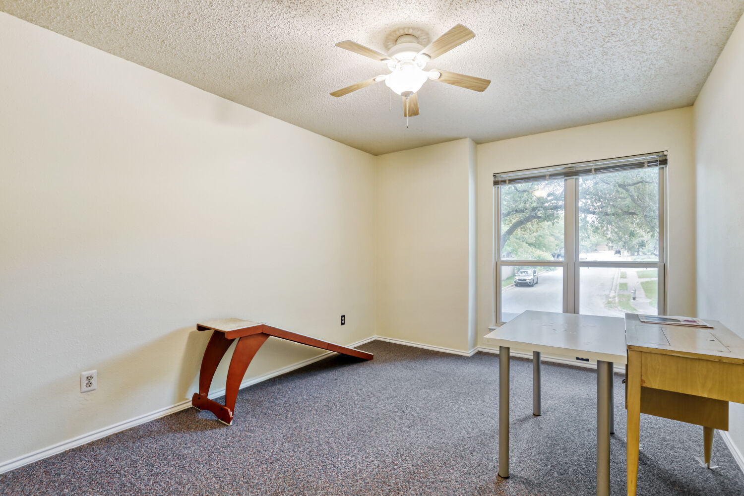 13129 New Boston Bend Austin, TX 78729 - Photo 12 of 26 Unfurnished office with dark colored carpet, a ceiling fan, and a textured ceiling