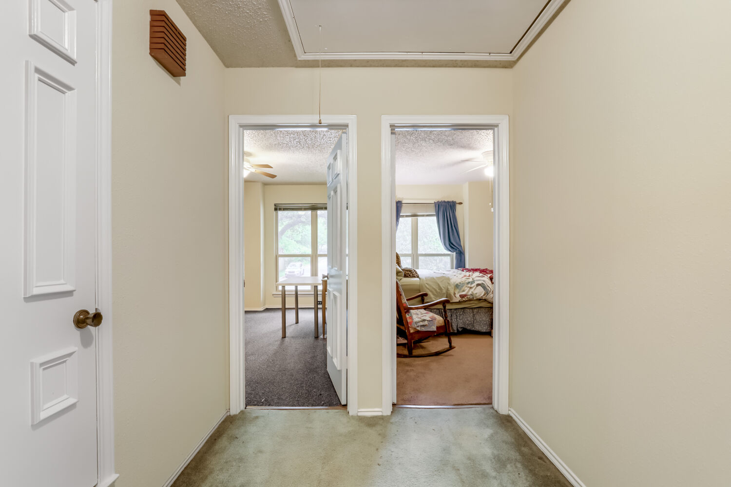 13129 New Boston Bend Austin, TX 78729 - Photo 17 of 26 Hallway with a textured ceiling and light carpet
