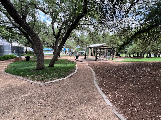 13129 New Boston Bend Austin, TX 78729 - Photo 24 of 26 The community features extensive green spaces with mature trees, a covered picnic area, and a playground