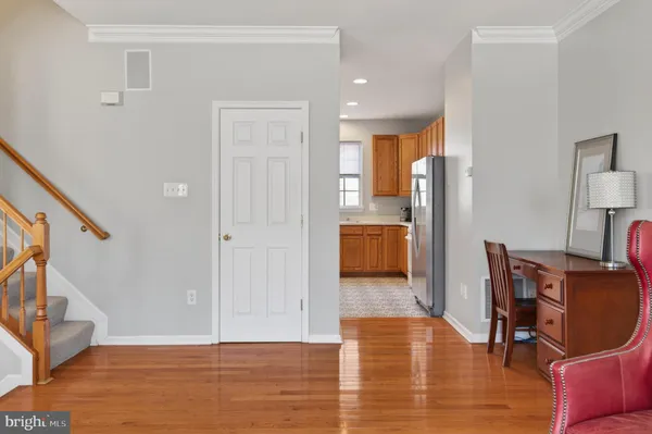 a kitchen with stainless steel appliances granite countertop a refrigerator stove microwave and sink