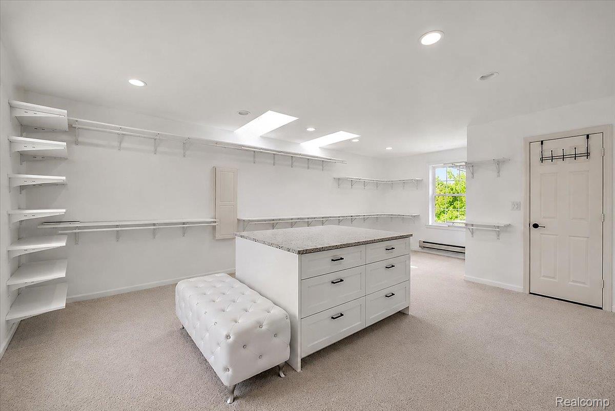62650 Mound Road Washington, MI 48094 - Photo 42 of 76 Oversized walk-in closet with large center storage island