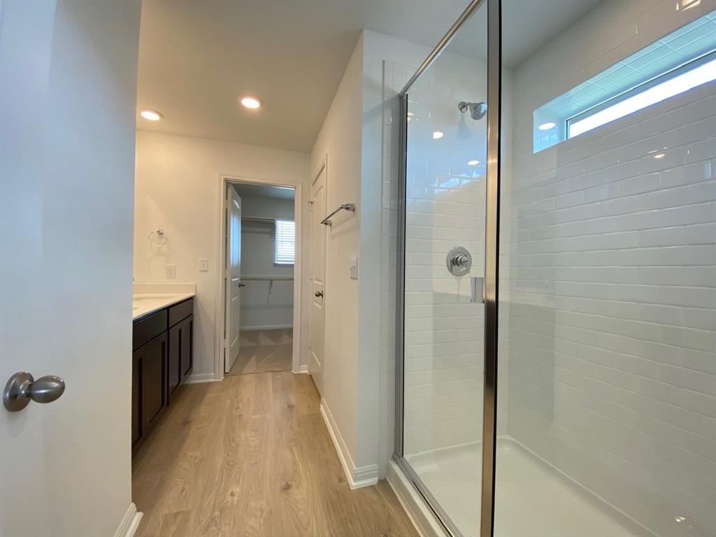 225 Saide Street Georgetown, TX 78626 - Photo 13 of 22 a bathroom with a sink and a mirror