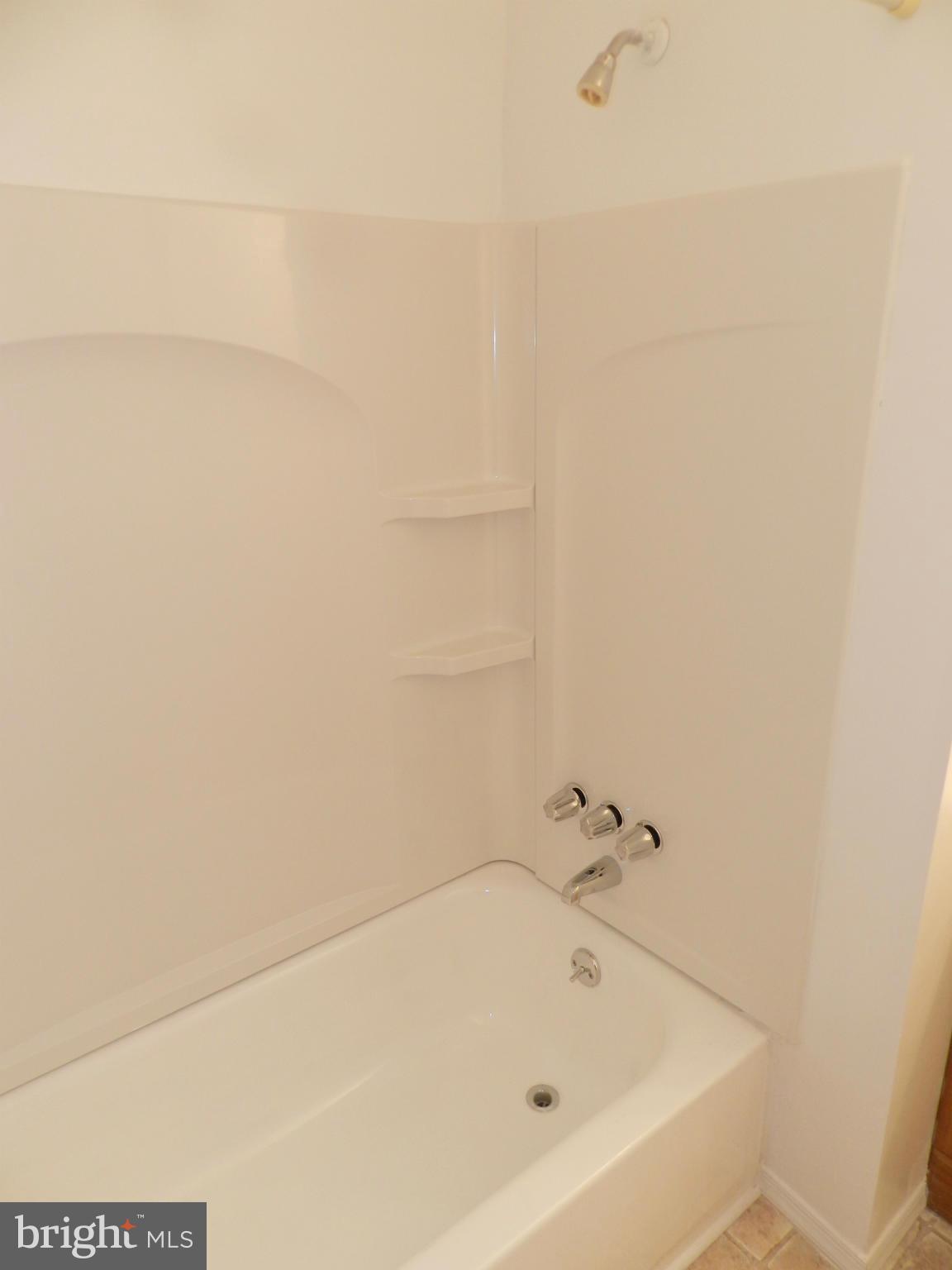 17435 Hughes Road Poolesville, MD 20837 - Photo 14 of 23 a bathroom with a bathtub