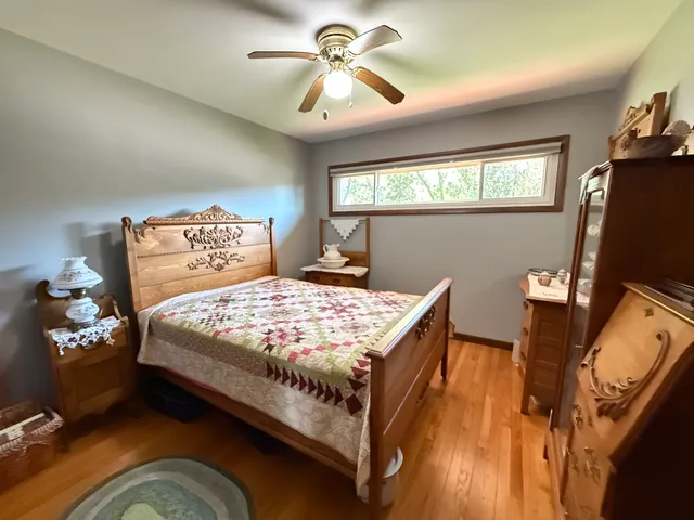 a living room with furniture a flat screen tv and a large window