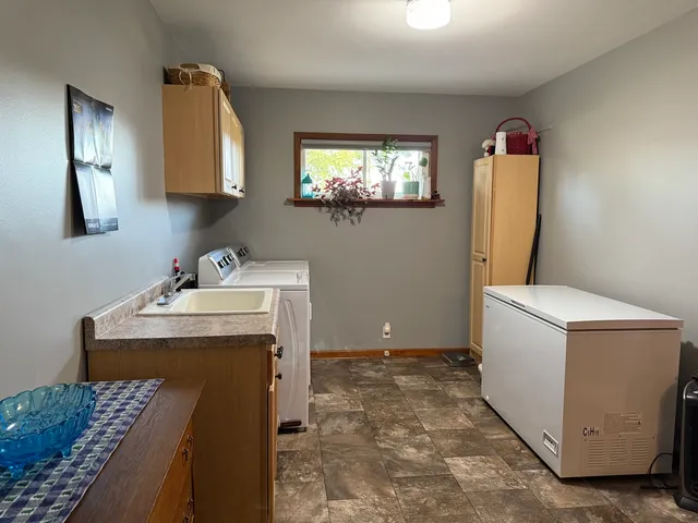 a spacious bathroom with a sink vanity and mirror