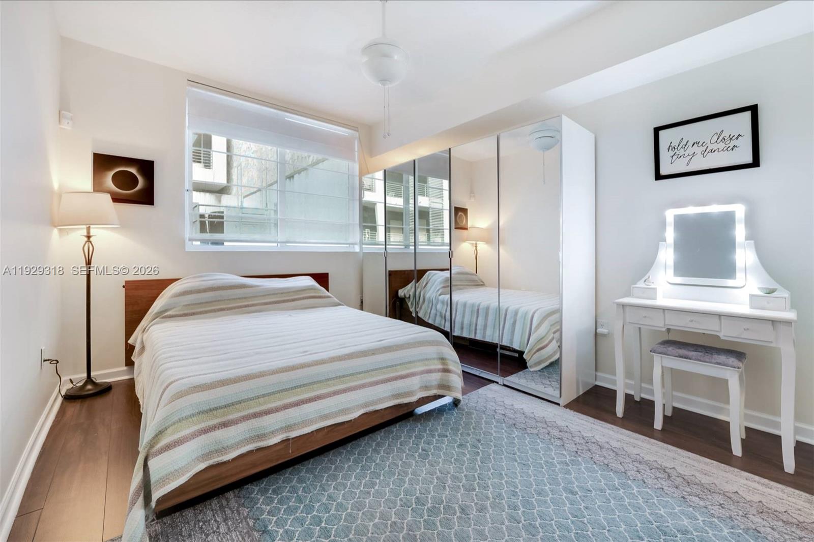 3339 Virginia Street, Unit 305 Miami, FL 33133 - Photo 11 of 17 a bedroom with bed and a window