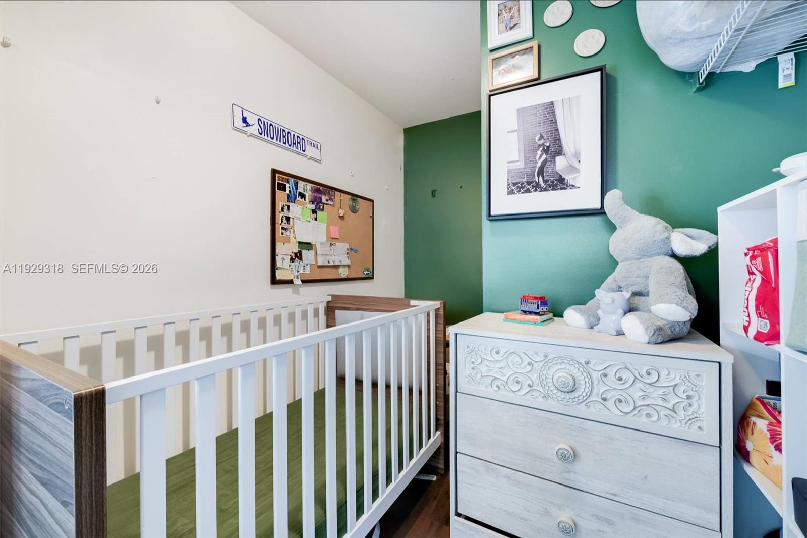 3339 Virginia Street, Unit 305 Miami, FL 33133 - Photo 12 of 17 a bedroom with furniture and a baby crib
