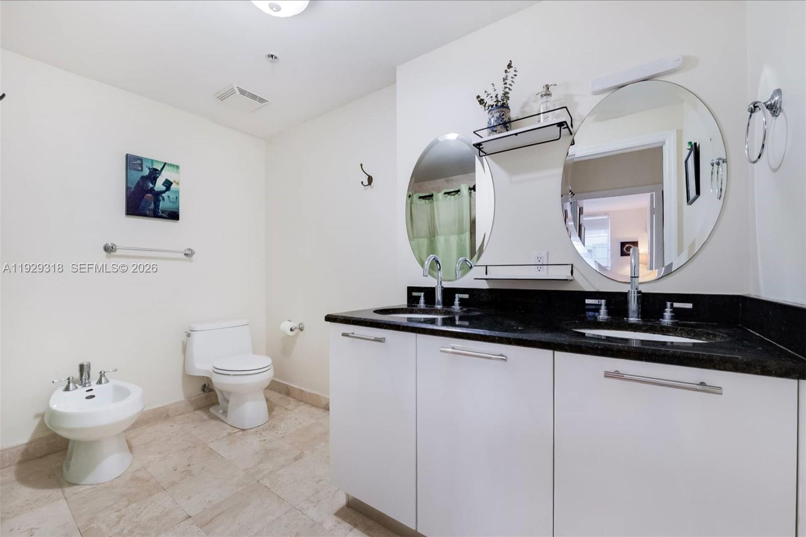 3339 Virginia Street, Unit 305 Miami, FL 33133 - Photo 13 of 17 a bathroom with a sink and a mirror