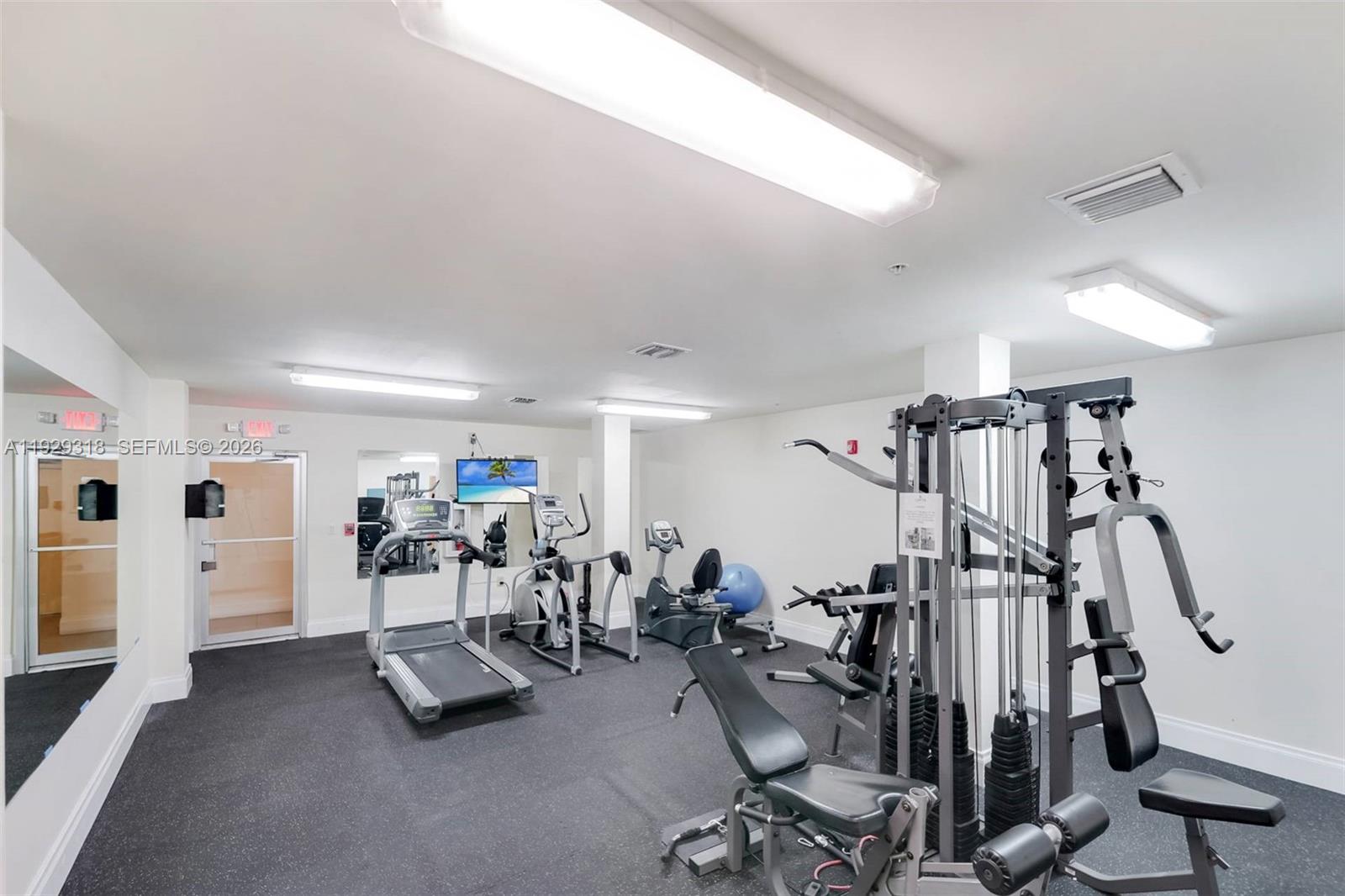 3339 Virginia Street, Unit 305 Miami, FL 33133 - Photo 16 of 17 a view of a room with gym equipment
