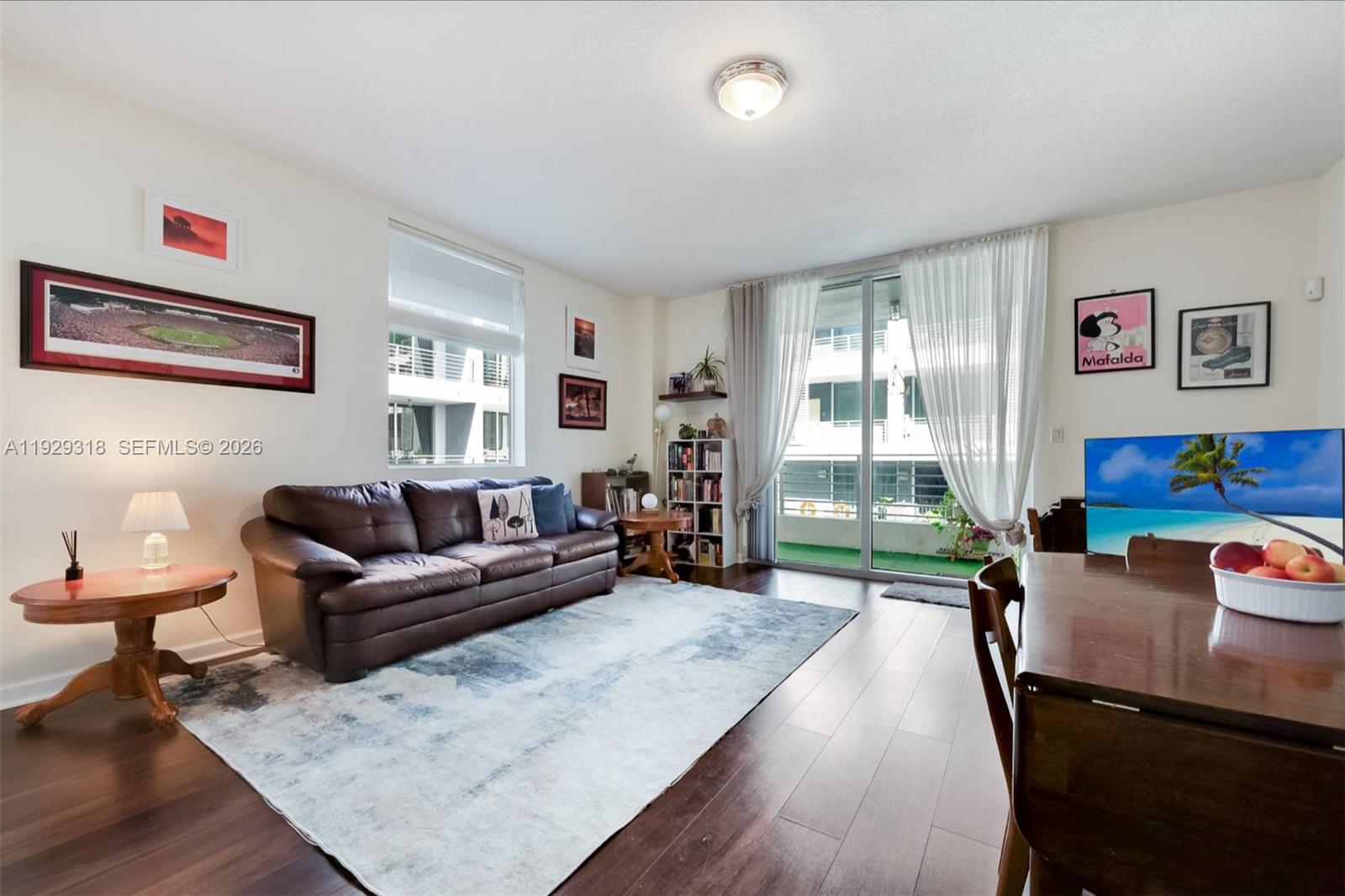 3339 Virginia Street, Unit 305 Miami, FL 33133 - Photo 10 of 17 a living room with furniture and a large window