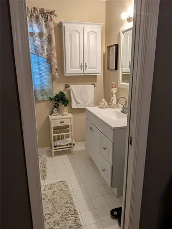 a bathroom with a sink a vanity and a mirror