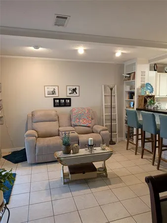 a living room with furniture and a table
