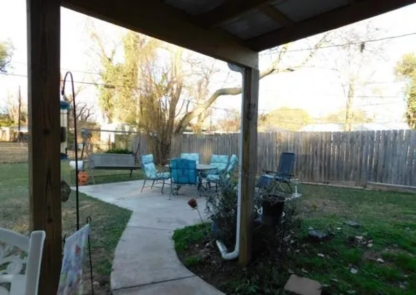 a view of backyard with plants and garden