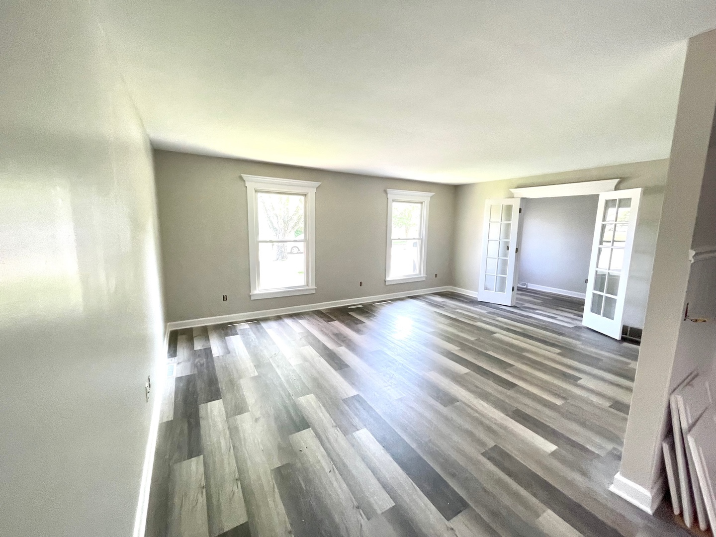 62 Fernwood Road Montgomery, IL 60538 - Photo 5 of 16 an empty room with wooden floor and windows