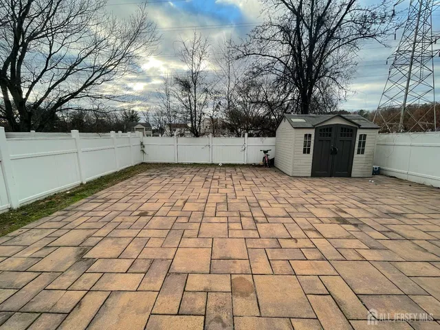 a view of a white house with a yard