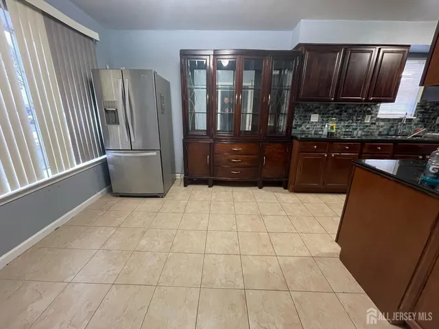 a view of kitchen with furniture and large window
