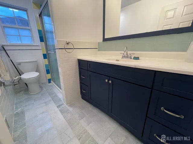 a bathroom with a sink and a toilet