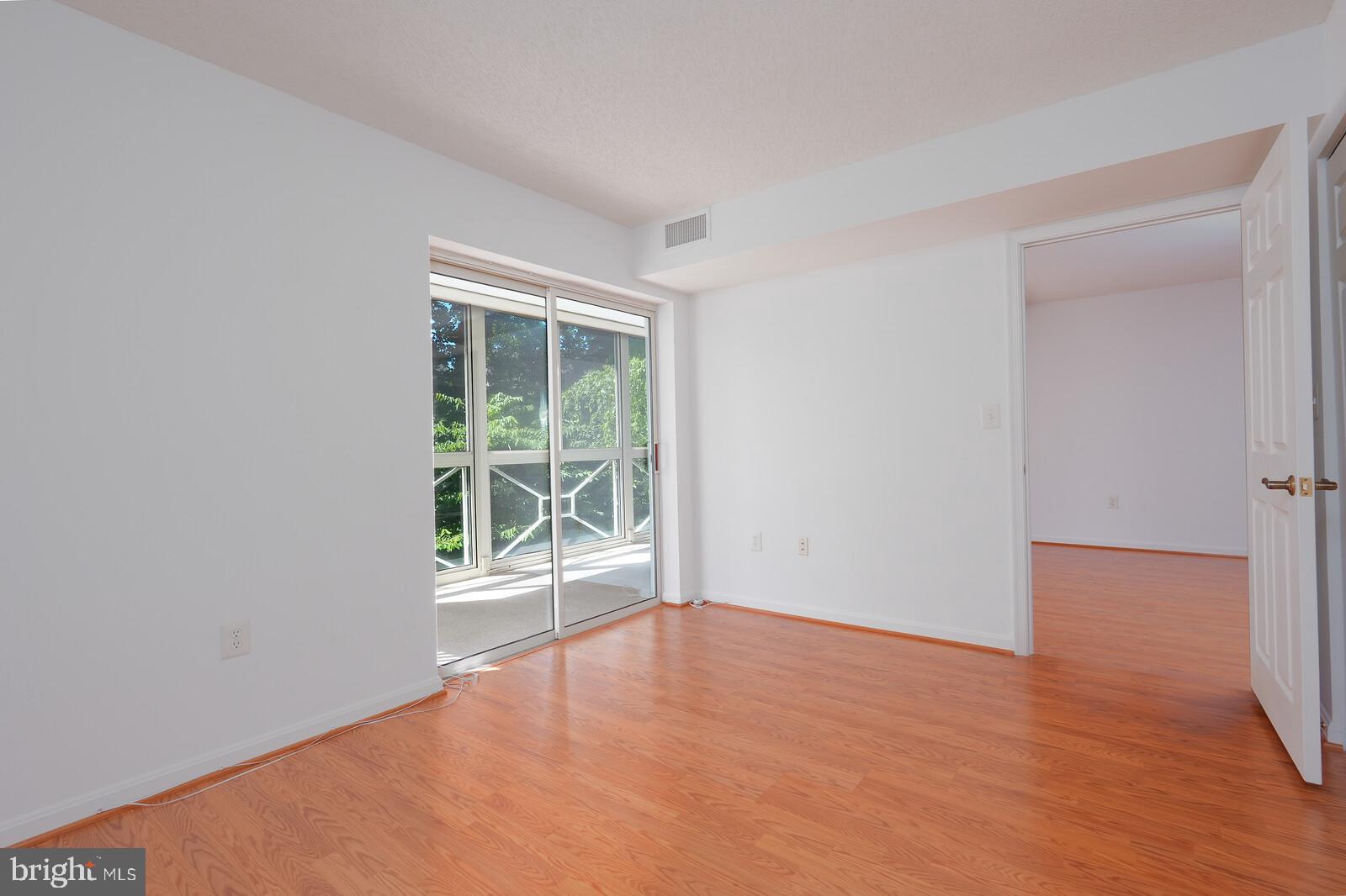 14800 Pennfield Circle, Unit 202 Silver Spring, MD 20906 - Photo 19 of 30 Guest room with separate access to sunroom